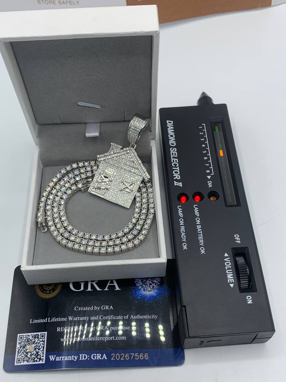 Iced-Out Trap House Pendant on a Neck Chain